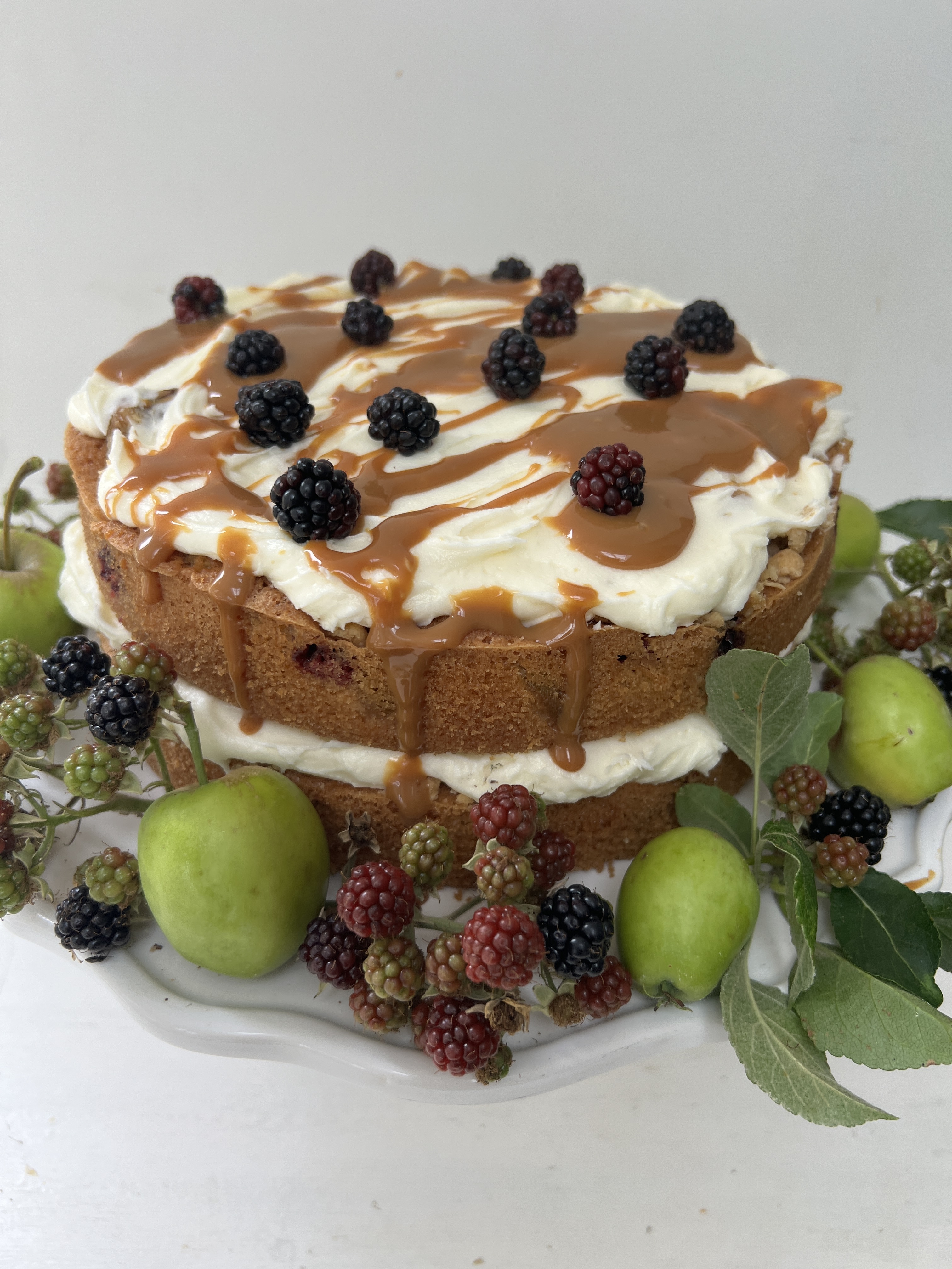 Blackberry, apple and pear crumble cake with sticky toffee sauce