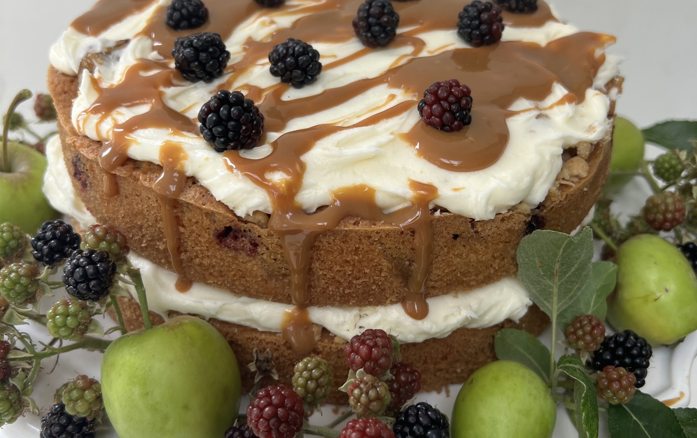 Blackberry, apple and pear crumble cake with sticky toffee sauce