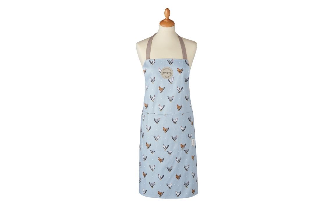 A Cooksmart cotton apron in the Farmer's Kitchen design of soft shades of blue, cream, grey and beige