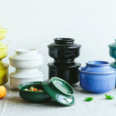 A collection of brightly coloured stacked Hokan bowls 