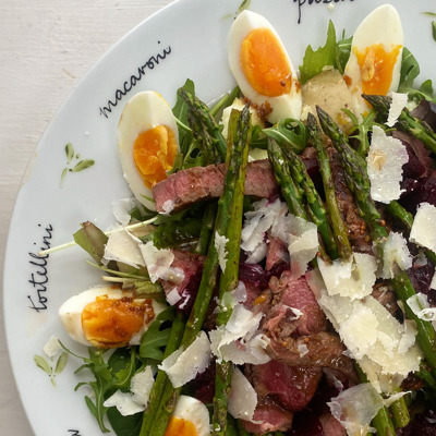 Summery beef salad with beetroot, rocket and eggs, new potatoes and asparagus