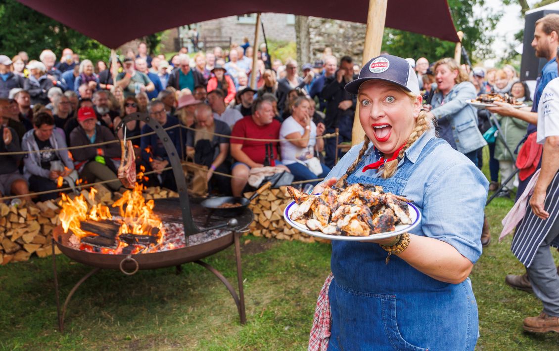 Chef cooking on a barbecue at Abergavenny Food Festival