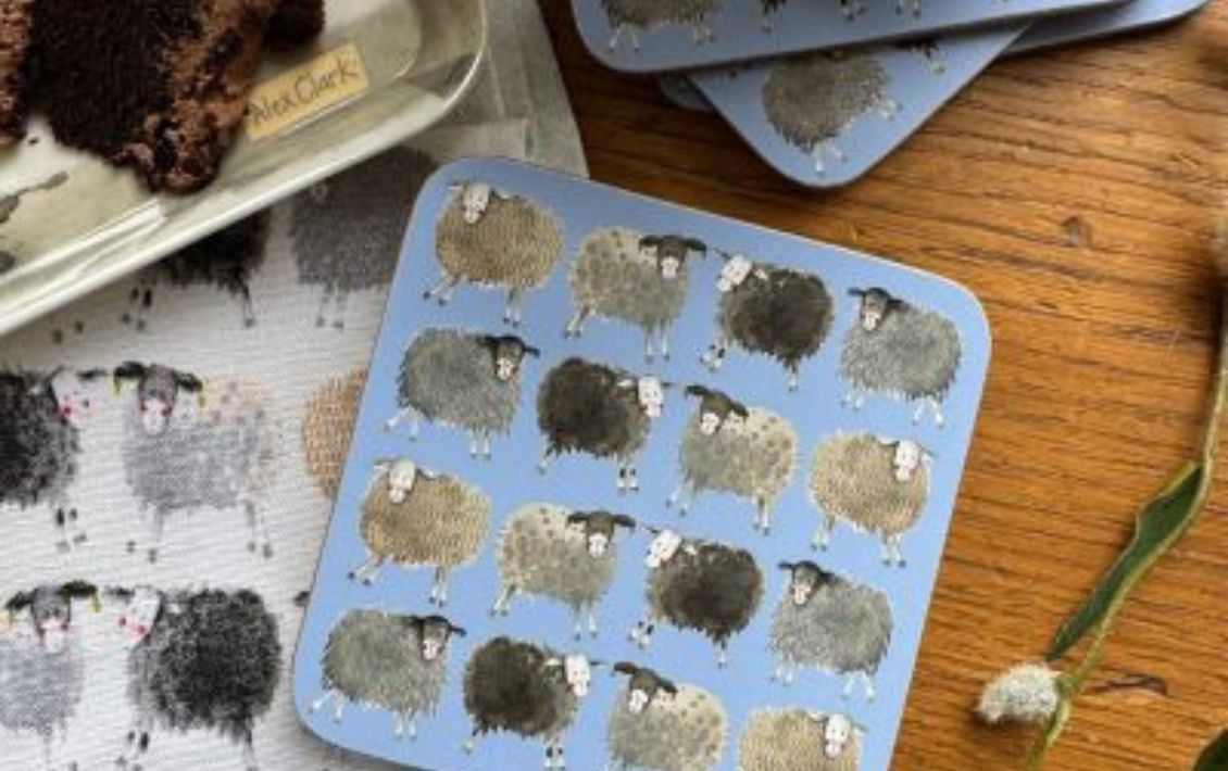 A set of pale blue drink coasters with a quirky sheep design