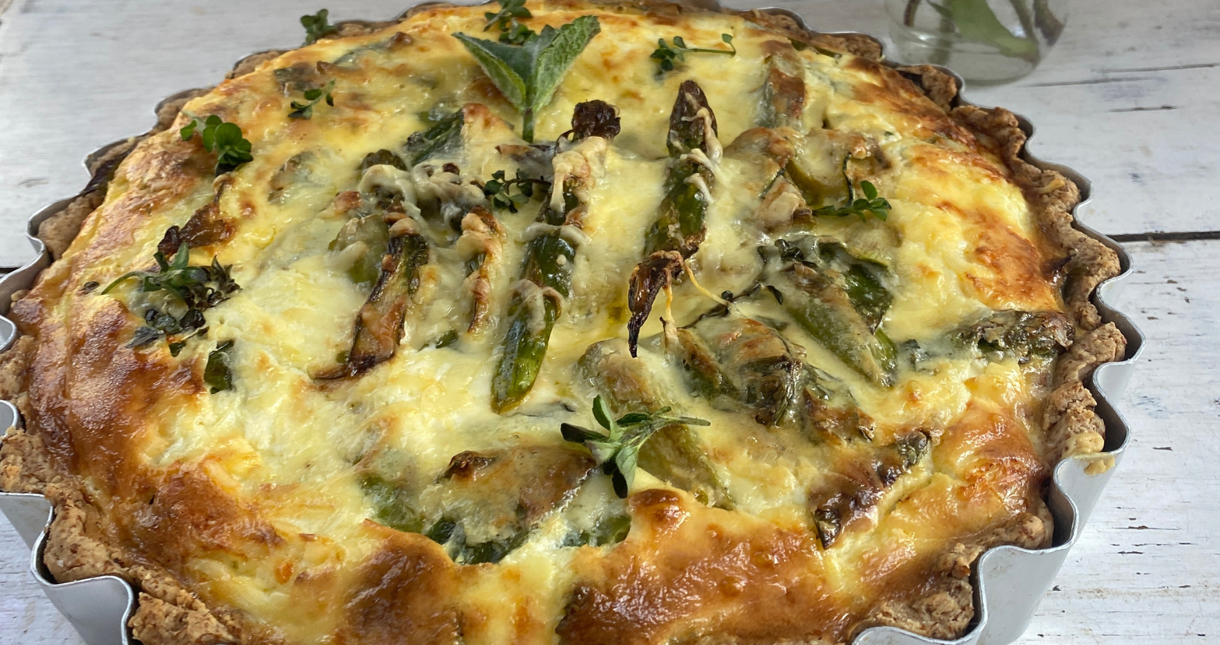 An image of a a hearty chicken, garden vegetable and mint quiche