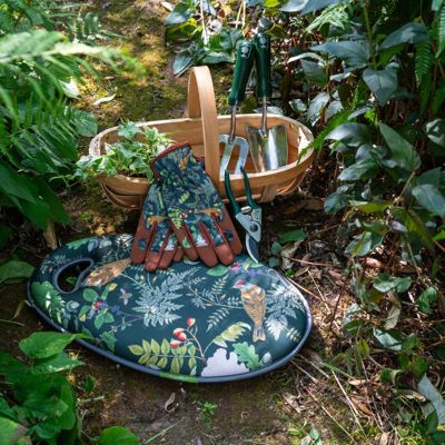 The Woodland Wonders collection of gardening tools from Burgon and Ball in a garden setting